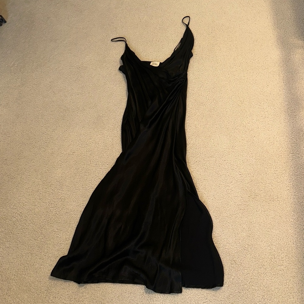 Black satin dress midi length with a slit and side ruching!